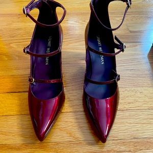 Stuart Weitzman never worn burgundy colored patent leather heels.  Never worn.
